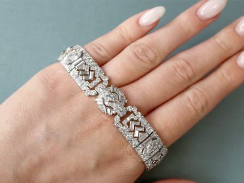 fig 2. An Art Deco platinum bracelet set with a central marquise diamond and surrounding geometric rows of baguette and round diamonds.