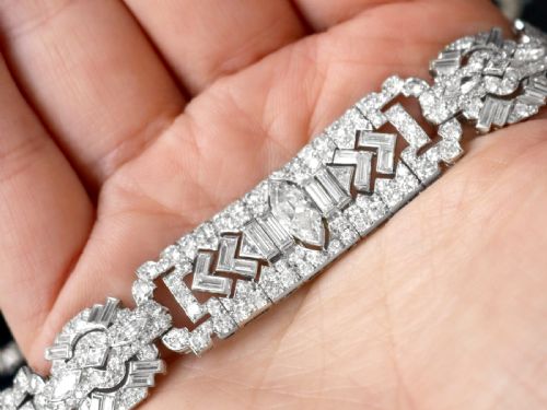 fig 3. An Art Deco platinum bracelet set with a central marquise diamond and surrounding geometric rows of baguette and round diamonds.