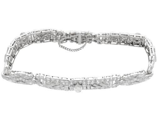 fig 4. An Art Deco platinum bracelet set with a central marquise diamond and surrounding geometric rows of baguette and round diamonds.
