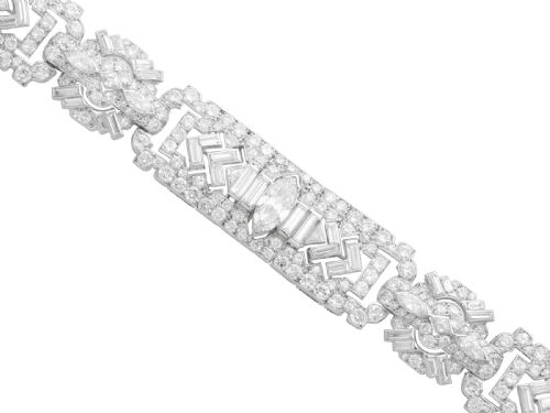 fig 5. An Art Deco platinum bracelet set with a central marquise diamond and surrounding geometric rows of baguette and round diamonds.