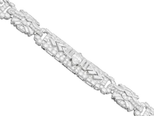 fig 6. An Art Deco platinum bracelet set with a central marquise diamond and surrounding geometric rows of baguette and round diamonds.