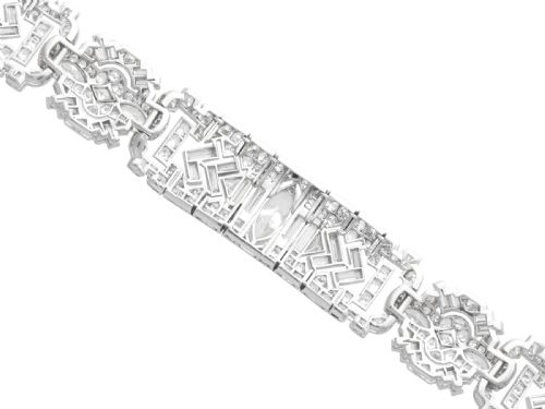 fig 7. An Art Deco platinum bracelet set with a central marquise diamond and surrounding geometric rows of baguette and round diamonds.