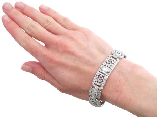 fig 10. An Art Deco platinum bracelet set with a central marquise diamond and surrounding geometric rows of baguette and round diamonds.