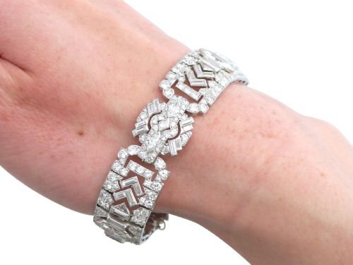 fig 11. An Art Deco platinum bracelet set with a central marquise diamond and surrounding geometric rows of baguette and round diamonds.