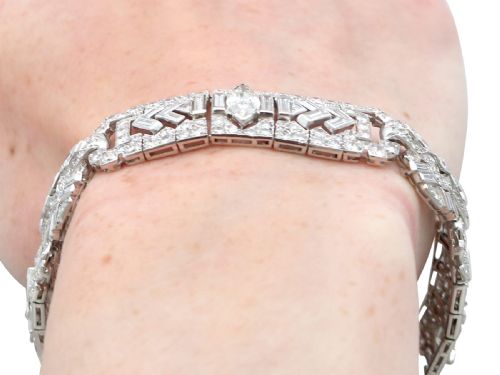 fig 12. An Art Deco platinum bracelet set with a central marquise diamond and surrounding geometric rows of baguette and round diamonds.