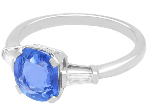 fig 4. An Art Deco platinum ring featuring a cushion-cut blue sapphire flanked by two tapered baguette diamonds.