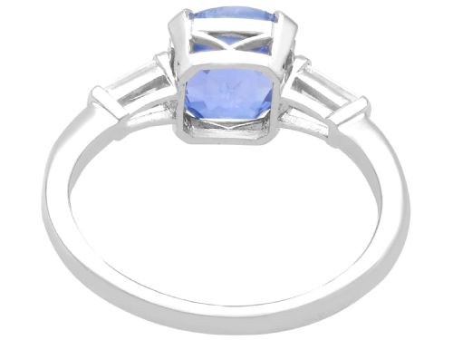 fig 5. An Art Deco platinum ring featuring a cushion-cut blue sapphire flanked by two tapered baguette diamonds.