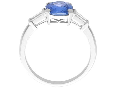 fig 6. An Art Deco platinum ring featuring a cushion-cut blue sapphire flanked by two tapered baguette diamonds.