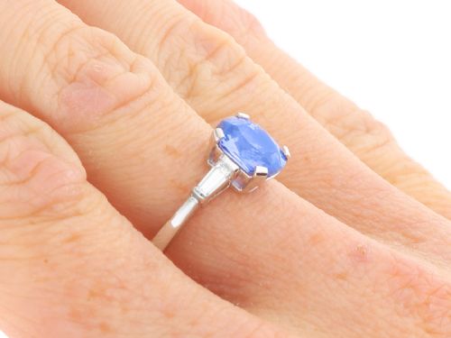fig 9. An Art Deco platinum ring featuring a cushion-cut blue sapphire flanked by two tapered baguette diamonds.