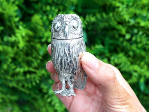 fig 1. A pair of Edwardian sterling silver pepperettes sculpted in the shape of standing owls with textured feather detailing.