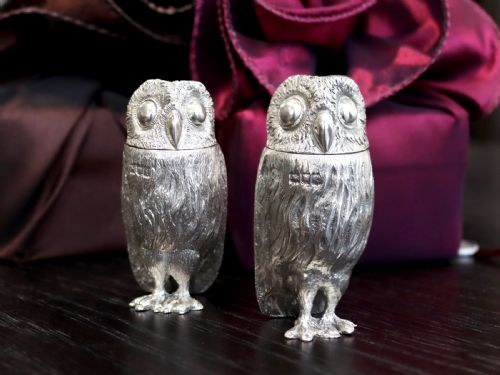 fig 2. A pair of Edwardian sterling silver pepperettes sculpted in the shape of standing owls with textured feather detailing.