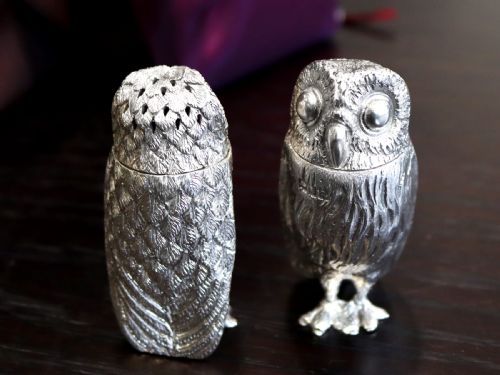 fig 3. A pair of Edwardian sterling silver pepperettes sculpted in the shape of standing owls with textured feather detailing.