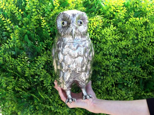 fig 1. An antique sterling silver sugar box realistically cast and chased in the form of a standing owl with detailed feather textures and set eyes.