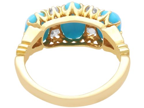 fig 7. A late Victorian 15ct yellow gold ring featuring three oval turquoise cabochons separated by small diamond accents.