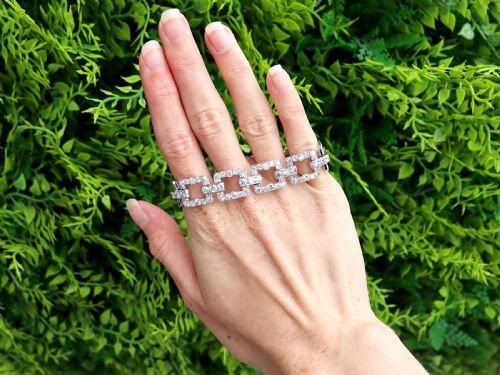 fig 1. An Art Deco platinum link bracelet set with round diamonds throughout four open rectangular square links.