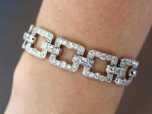 fig 2. An Art Deco platinum link bracelet set with round diamonds throughout four open rectangular square links.
