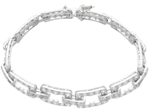fig 4. An Art Deco platinum link bracelet set with round diamonds throughout four open rectangular square links.