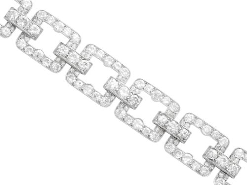 fig 5. An Art Deco platinum link bracelet set with round diamonds throughout four open rectangular square links.
