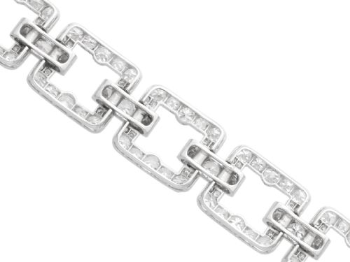 fig 7. An Art Deco platinum link bracelet set with round diamonds throughout four open rectangular square links.