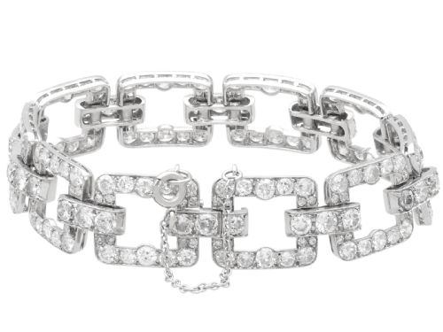 fig 8. An Art Deco platinum link bracelet set with round diamonds throughout four open rectangular square links.