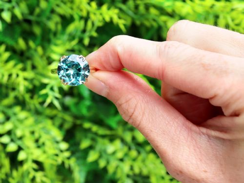 fig 1. An Edwardian 18ct yellow gold solitaire ring mounted with a round brilliant cut vibrant blue zircon in a claw setting.