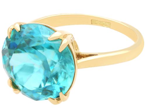 fig 5. An Edwardian 18ct yellow gold solitaire ring mounted with a round brilliant cut vibrant blue zircon in a claw setting.