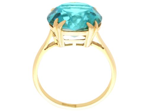fig 7. An Edwardian 18ct yellow gold solitaire ring mounted with a round brilliant cut vibrant blue zircon in a claw setting.
