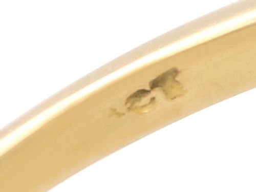 fig 6. A substantial rectangular emerald-cut light blue aquamarine gemstone secured in a four-claw 18ct yellow gold ring mounting.