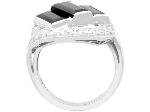 fig 6. An Art Deco style platinum dress ring displaying three vertical rectangular black onyx plaques enclosed within a circular diamond-set halo frame.