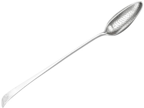 fig 1. An 18th-century sterling silver gravy straining spoon in the Old English pattern with a perforated bowl partition and engraved terminal monogram.