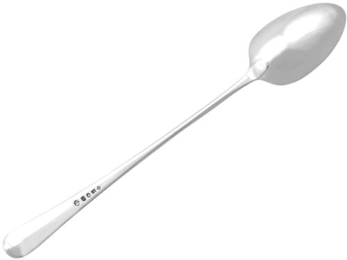 fig 3. An 18th-century sterling silver gravy straining spoon in the Old English pattern with a perforated bowl partition and engraved terminal monogram.