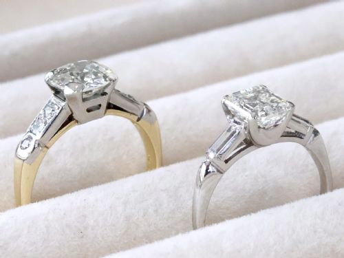 fig 3. A platinum solitaire ring featuring a central square step-cut diamond flanked by two baguette diamonds on a plain band.