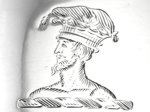fig 6. An egg-shaped George III sterling silver condiment caster featuring a perforated upper section, reeded borders, a small engraved crest, and a pedestal foot.