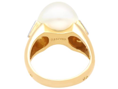 fig 6. A vintage 18ct yellow gold ring featuring a central round cream cultured pearl flanked by two triangular diamonds.