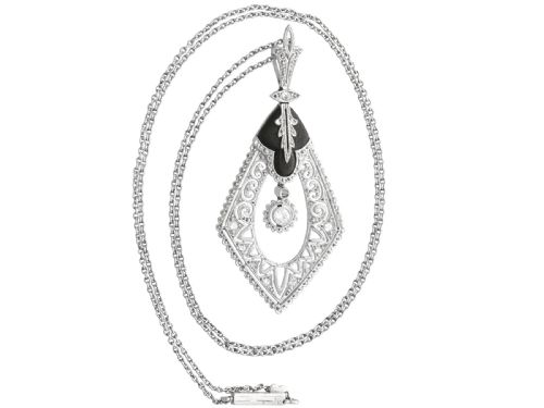 fig 4. A diamond-shaped Art Deco platinum filigree pendant set with carved black onyx and a central suspended diamond drop.