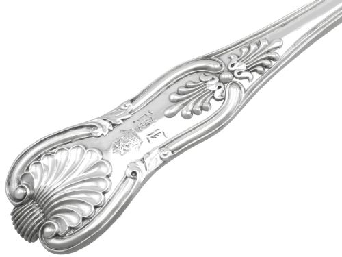 fig 5. An antique William IV sterling silver ice cream server featuring a broad shovel-shaped blade and a handle decorated with a shell motif.