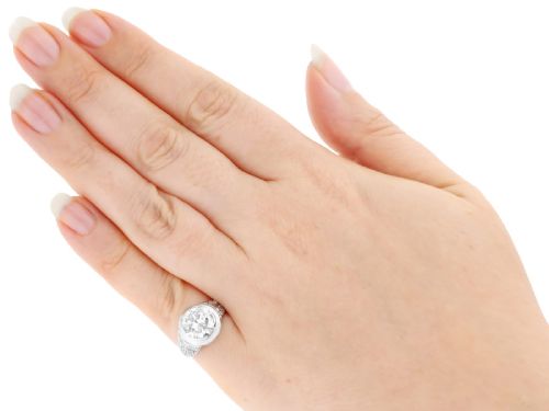 fig 6. An Art Deco platinum ring featuring a central round diamond set in a smooth bezel with accent diamonds on the shoulders.