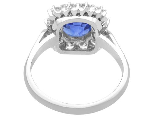fig 5. A vintage platinum dress ring featuring a cushion-cut blue Ceylon sapphire surrounded by a cluster of round brilliant-cut diamonds.