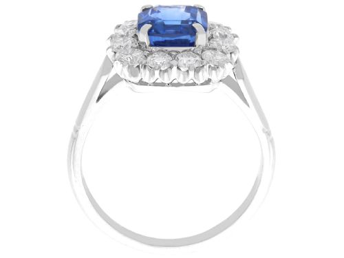 fig 6. A vintage platinum dress ring featuring a cushion-cut blue Ceylon sapphire surrounded by a cluster of round brilliant-cut diamonds.