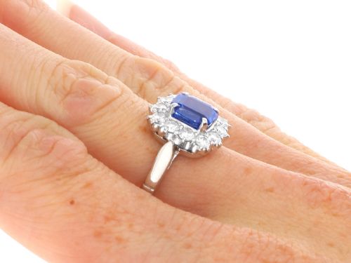 fig 8. A vintage platinum dress ring featuring a cushion-cut blue Ceylon sapphire surrounded by a cluster of round brilliant-cut diamonds.