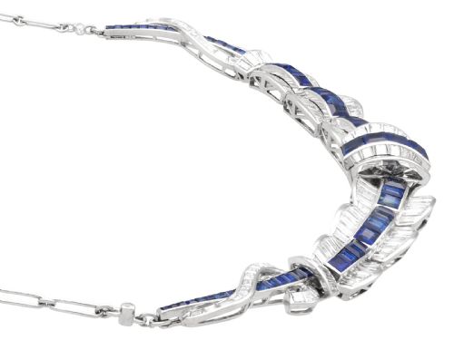 fig 11. An Art Deco platinum collar necklace set with central square-cut blue sapphires bordered by baguette and round diamonds.