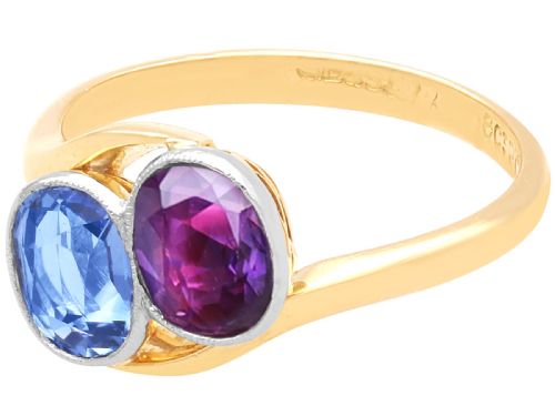 fig 6. An Edwardian 18ct yellow gold twist ring set with a cushion cut blue sapphire and pink sapphire in platinum settings.