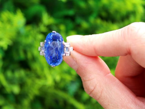fig 1. A large oval blue Ceylon sapphire set in platinum with stepped baguette diamond shoulders.