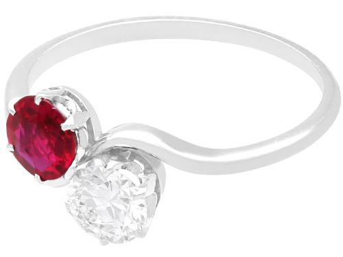 fig 4. An Art Deco platinum twist ring featuring a circular red Burmese ruby and a brilliant white diamond set side by side on a curved band.