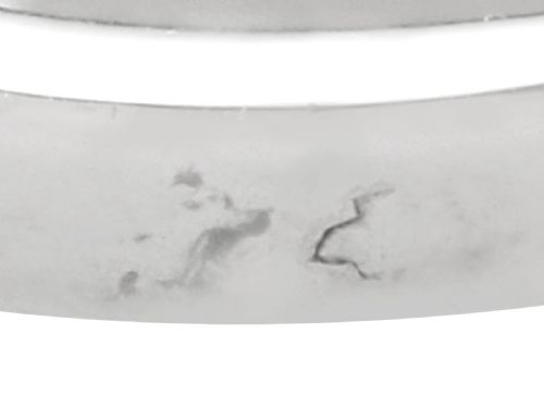 fig 11. An Art Deco platinum cocktail ring set with a central rectangular emerald flanked by round diamonds and baguette diamonds.