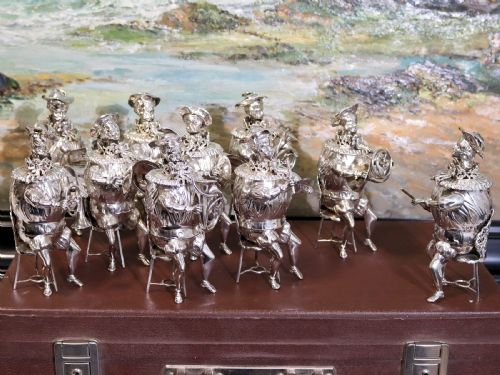 fig 3. A set of German sterling silver musician figures depicting a miniature band with instruments in historic costume.