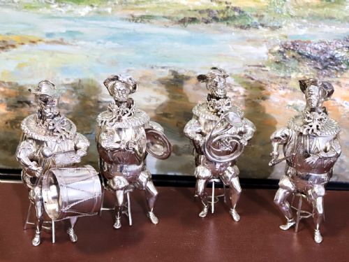 fig 4. A set of German sterling silver musician figures depicting a miniature band with instruments in historic costume.