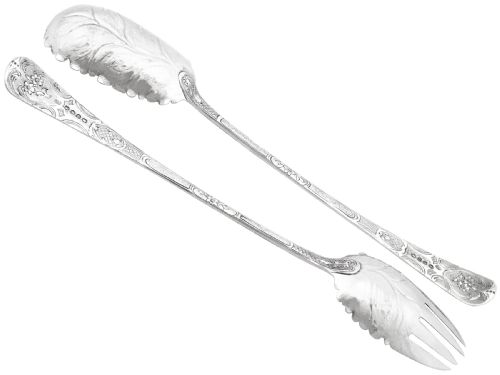 fig 1. Pair of antique George III sterling silver salad servers with leaf-shaped bowls and engraved stems.