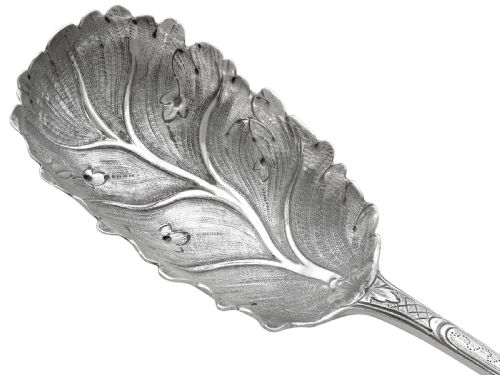 fig 5. Pair of antique George III sterling silver salad servers with leaf-shaped bowls and engraved stems.