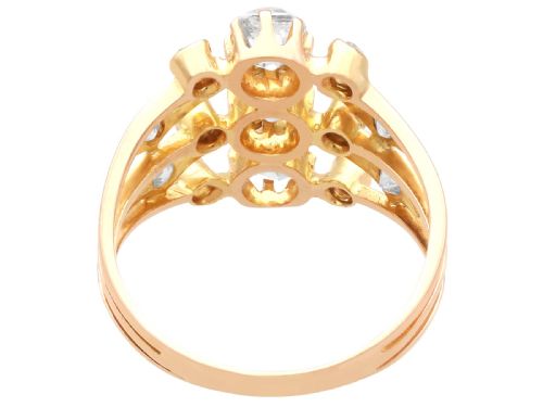 fig 8. An 18ct yellow gold Victorian dress ring featuring three openwork bands set with cushion-cut and round diamonds.